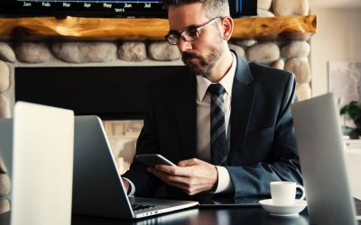 man in black holding phone